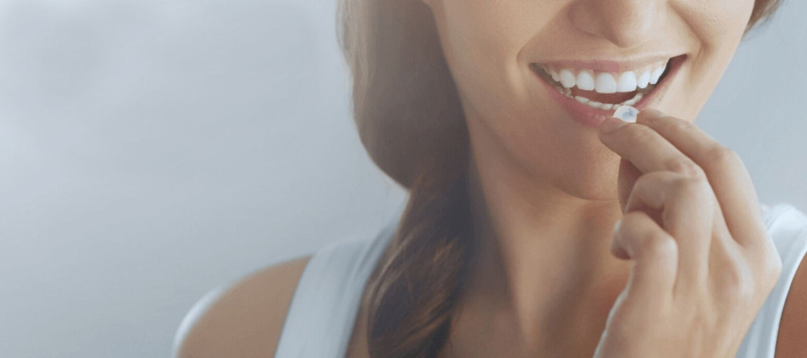 Woman smiling while trying a WinterMynt from Myntz! Breathmints