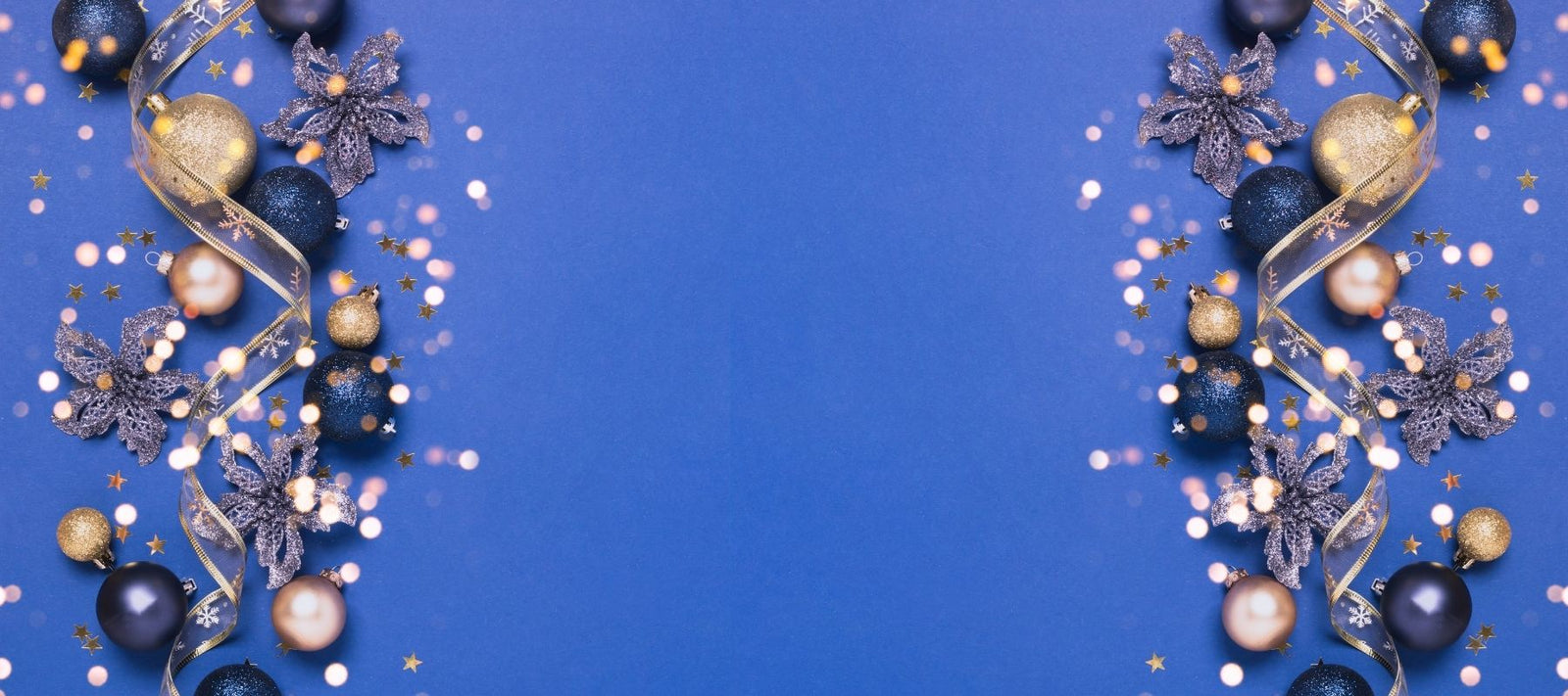 Confetti and decorations against a blue background to celebrate 2021