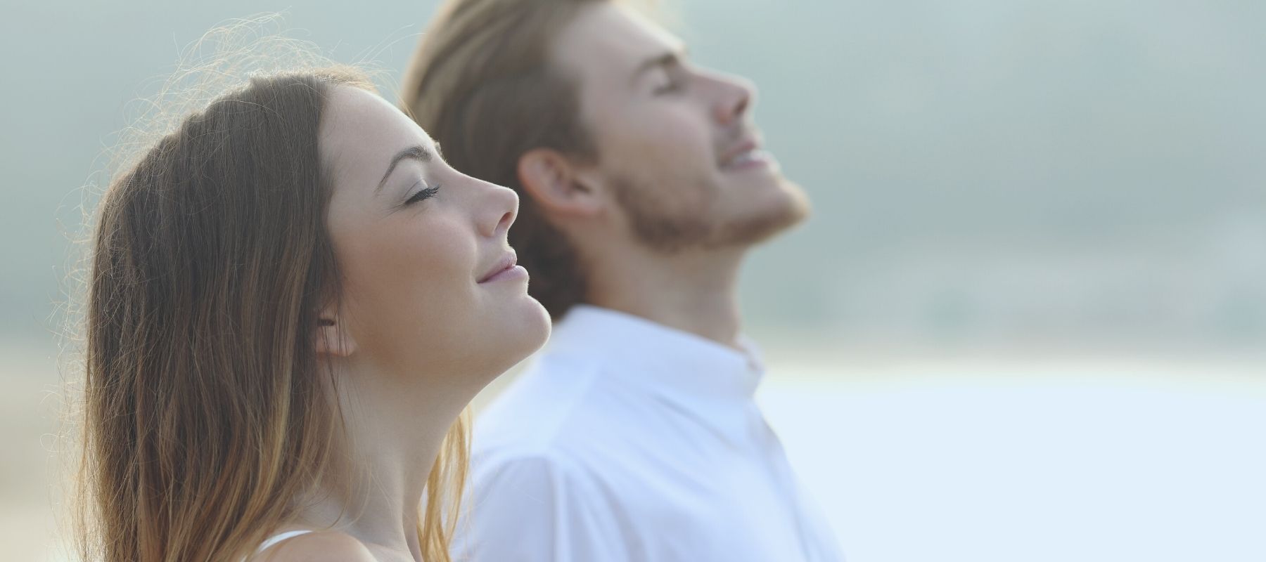 Man and woman breathing in fresh air together